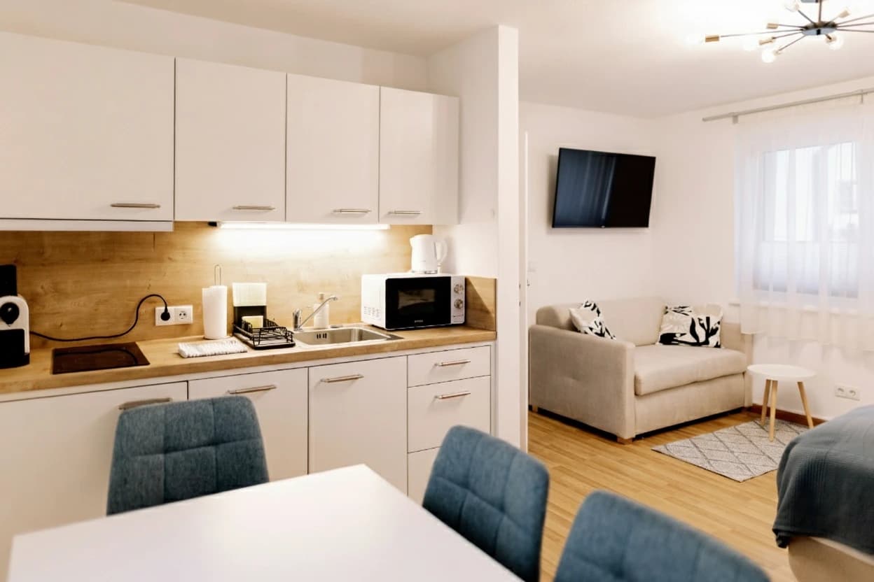 Cozy double bed with quality bedding in Haus Montis Studio, perfect for couples