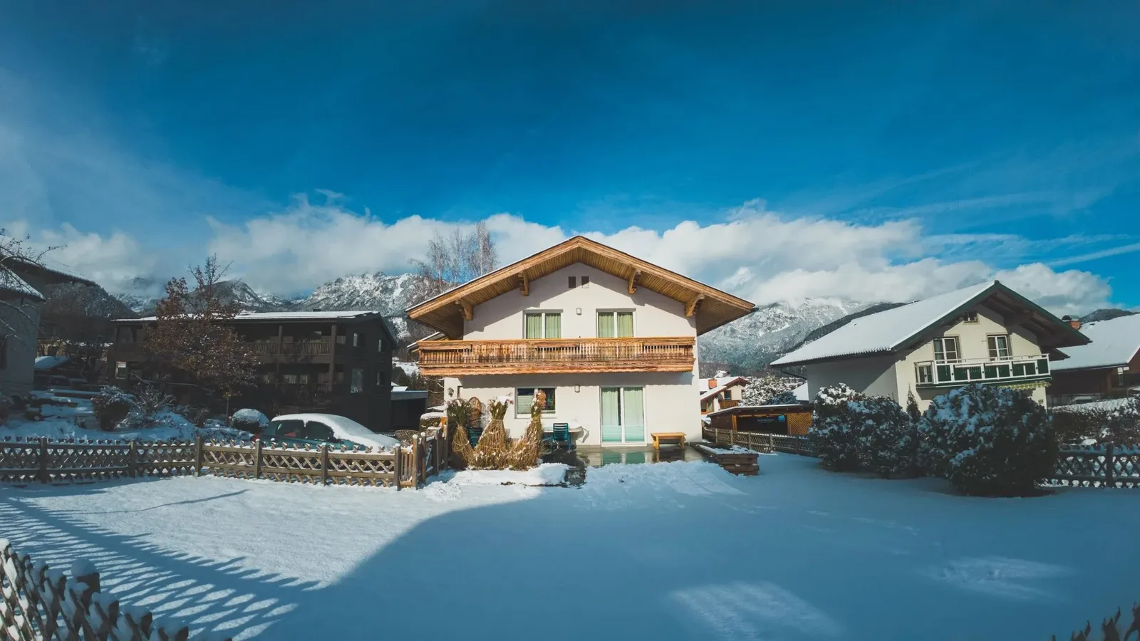 Haus Montis in winter: the house under snow with the Hauser Kaibling mountains behind